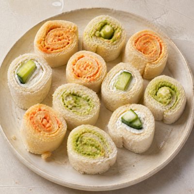 Maki-style sandwich slices with hummus, carrot, cucumber and avocado fillings