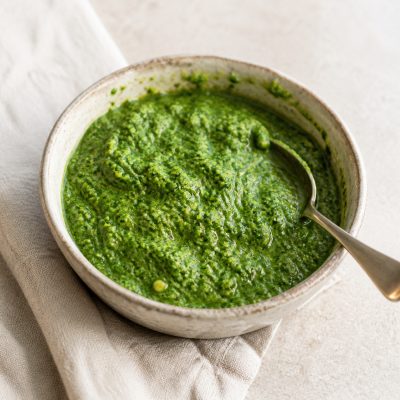 Homemade spinach pesto in a rustic bowl